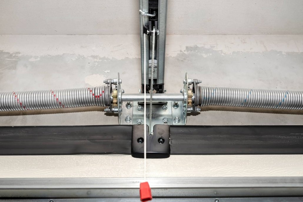 a technician performing garage door spring repair at Whitehall Garage Door Repair, ensuring safe and professional maintenance for residential garage doors.