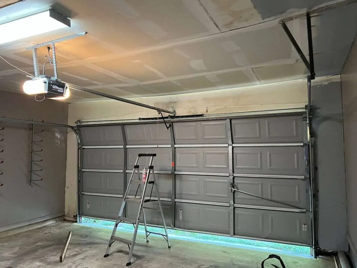 professional garage door opener repair services by Whitehall Garage Door Repair, featuring a skilled technician working on a garage door mechanism.