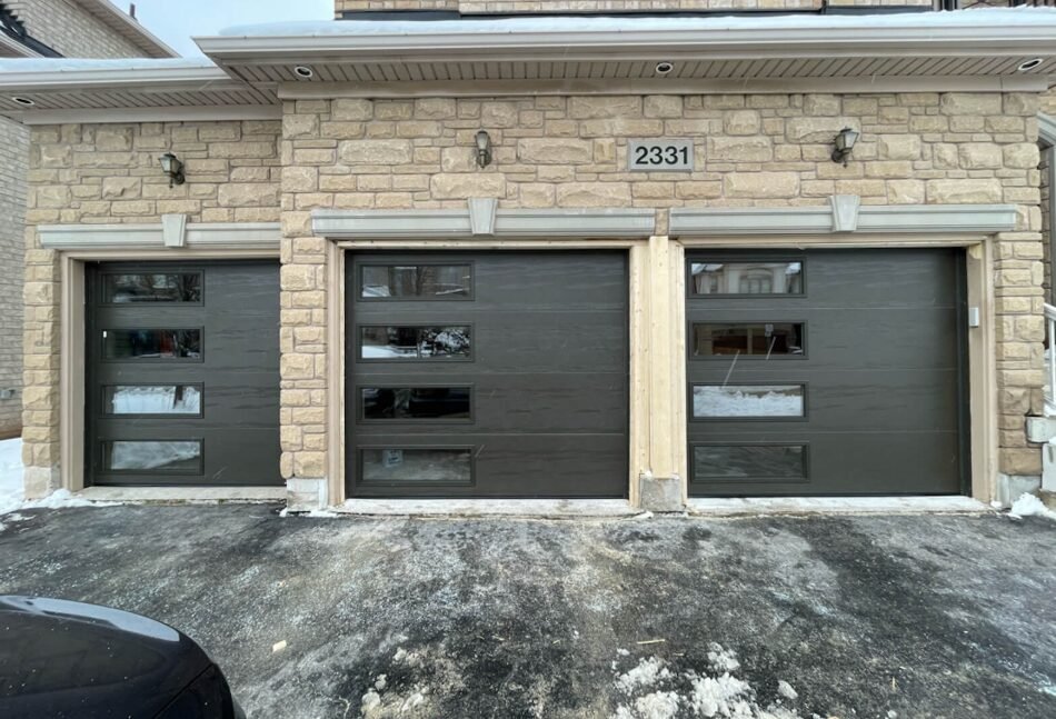 Professional garage door repair services provided by Whitehall Garage Door Repair LLC, showcasing expert technicians fixing a residential garage door.