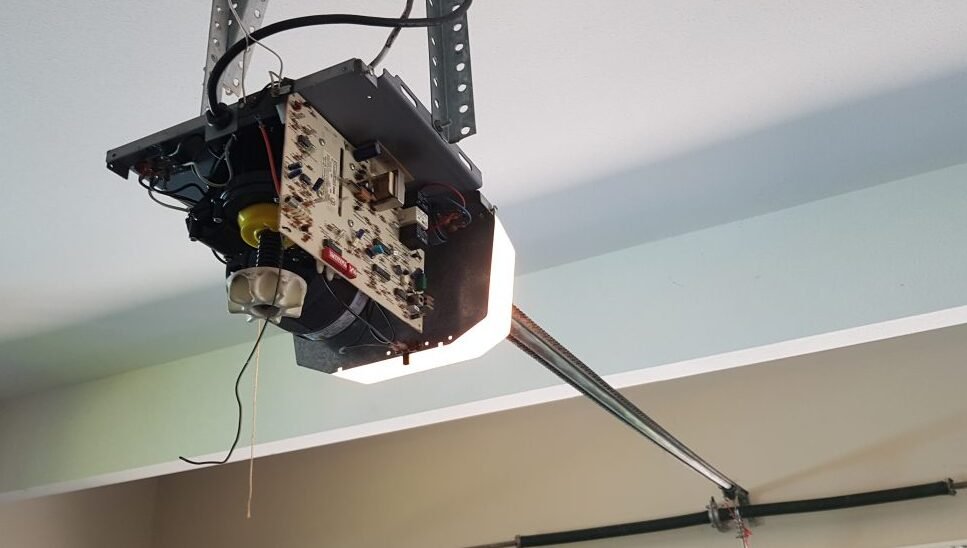 Professional technician performing garage door opener repair at Whitehall Garage Door Repair, enhancing operational efficiency and safety.